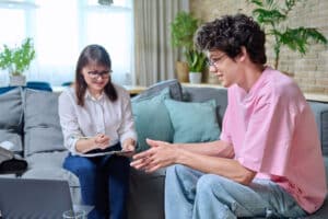 therapist answering the question what is an addiction aftercare program for young client